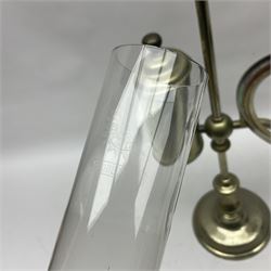 William H Honey polished brass adjustable student's oil lamp, with green glass shade, H60cm