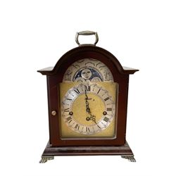 20th century- Hermle 8-day moon phase three train bracket clock, with a brass dial and subsidiary moon dial, floating balance escapement chiming the quarters on 5 gong rods. With an English oak cased Smiths Enfield 8-day striking mantle clock c1950. With pendulum and key.  