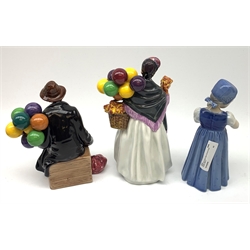 Royal Copenhagen figure of a young girl holding a doll and two Royal Doulton figures: Biddy Penny Farthing and The Balloon Man (3)