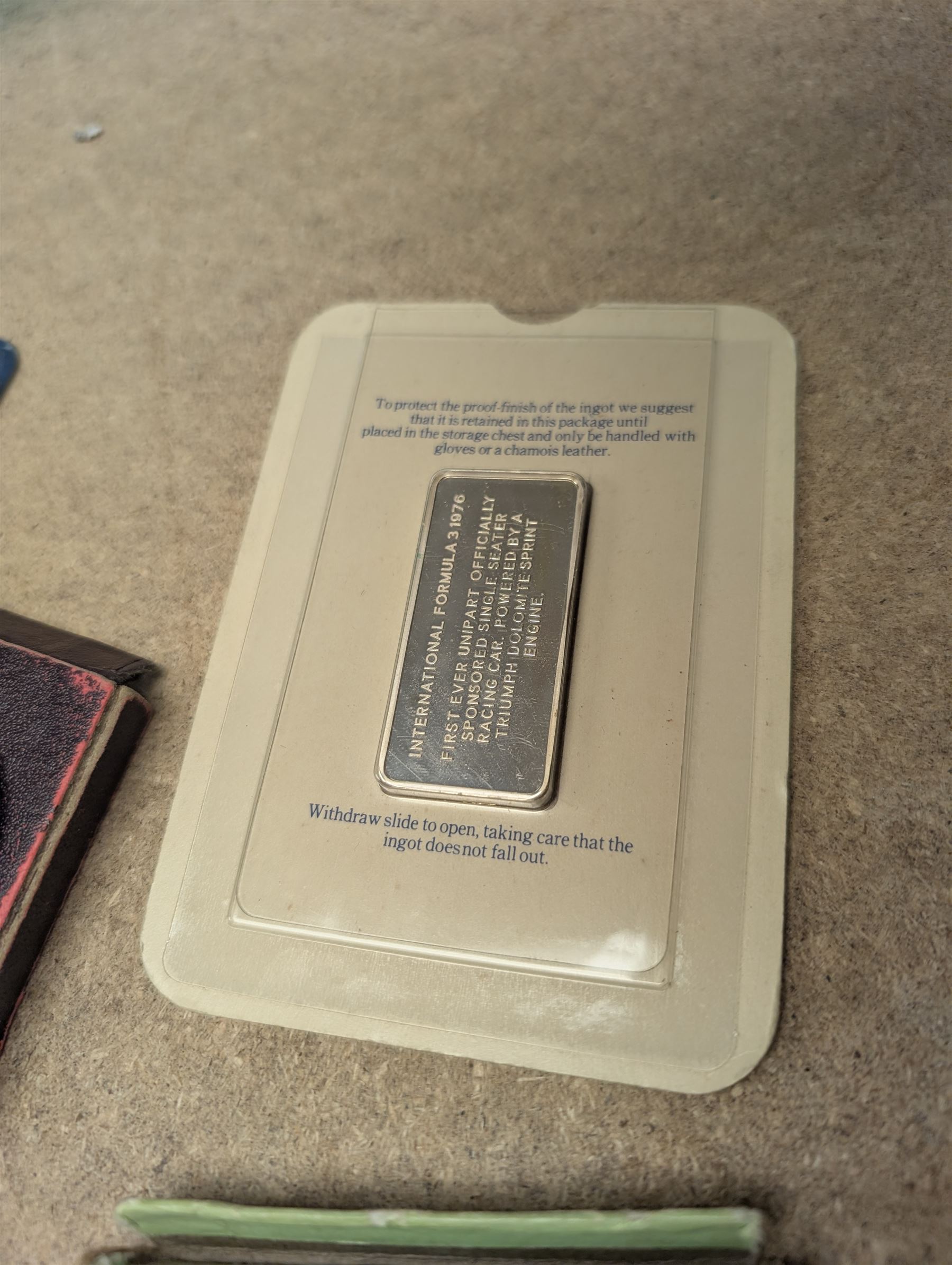 The Birmingham Mint International Formula 3 silver ingot, hallmarked, pair of sovereign scales, two silver fobs and others, etc and a collection of Great British coins