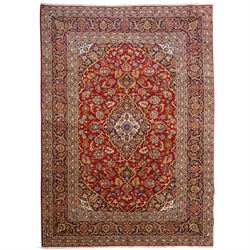 Central Persian Kashan hand-knotted carpet, crimson field with central cusped medallion in...