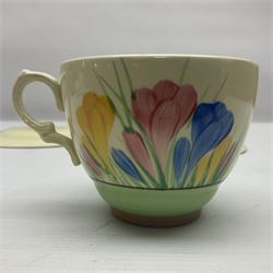 Clarice Cliff trio and plate in Spring Crocus pattern, all with printed mark beneath, plate D25cm 