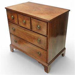 Small 19th century mahogany chest of drawers, rectangular top with moulded edge over three short and two long drawers, the drawers fitted with brass ring handles and key escutcheons, raised on shaped bracket feet