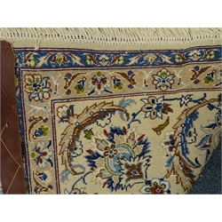  Fine Nain beige and blue ground rug, central medallion on floral field, repeating border, 307cm x 212cm  