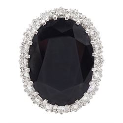18ct white gold large oval sapphire and round brilliant cut diamond cluster ring, sapphire approx 27.35 carat, total diamond weight approx 1.00 carat