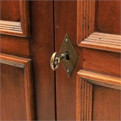 Willis & Gambier - French cherry double wardrobe, moulded cornice above panelled doors, enclosing a shelf and wooden hanging rail, raised on a moulded plinth with bracket feet