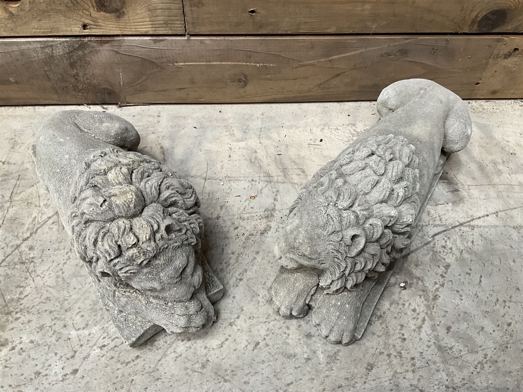 Pair of small cast stone sleeping Trafalgar Lions
