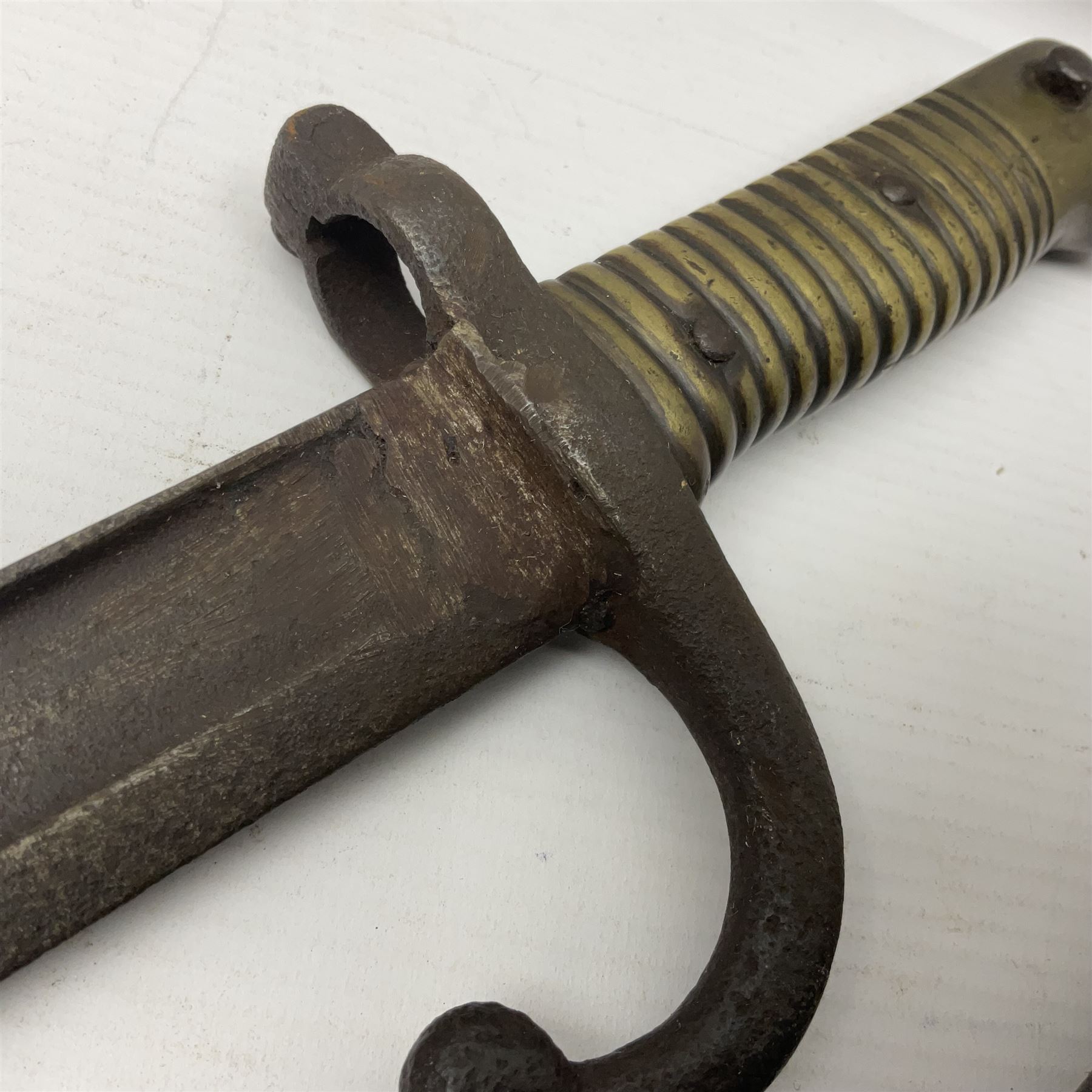 WWI Remington Pattern 1913 bayonet, the 43cm fullered blade with various marks to the ricasso including date code 11 16; in leather covered scabbard with various stamps including JWB 17 L58cm overall; and a French Model 1866 sabre bayonet (no scabbard)