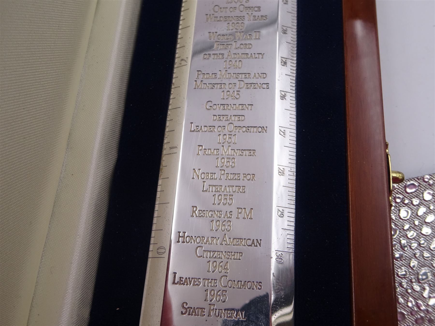 Modern silver 'Churchill Rule of Life' ruler, by Richard Jarvis of Pall Mall, engraved with the significant events and dates of Winston Churchill's life, from his birth in 1874 to his funeral in 1965, hallmarked Richard Jarvis, London 2007, L33.5cm, within wooden fitted case, with applied portrait to cover and silk and velvet lined interior