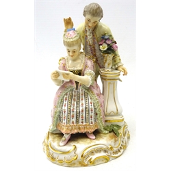  Late 19th/early 20th century meissen figure group of a seated lady reading a letter with a gentleman reading over her shoulder, H14cm  
