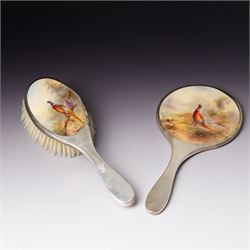 Silver backed brush and hand mirror inset with painted Royal Worcester panels by James Sti...