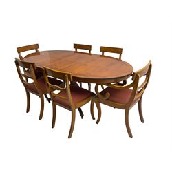 Regency design yew wood dining table, oval cross-banded top with reeded edge, raised on turned pedestal with reeded sabre supports terminating in brass hairy paw feet and castors (W138cm D100cm H75cm); and Rackstraw - set six (4+2) Regency design dining chairs with red drop-in seats (W50cm H86cm)