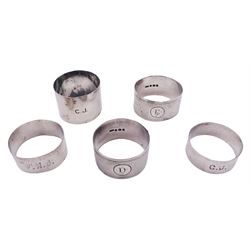 Five silver napkin rings, each of circular form, two examples with engine turned decoration, one Victorian example hallmarked Robert Thornton Birmingham 1869, a pair of Edwardian examples hallmarked T H Hazlewood & Co, Birmingham 1917, etc., approximate total weight 4.16 ozt (129.4 grams)

