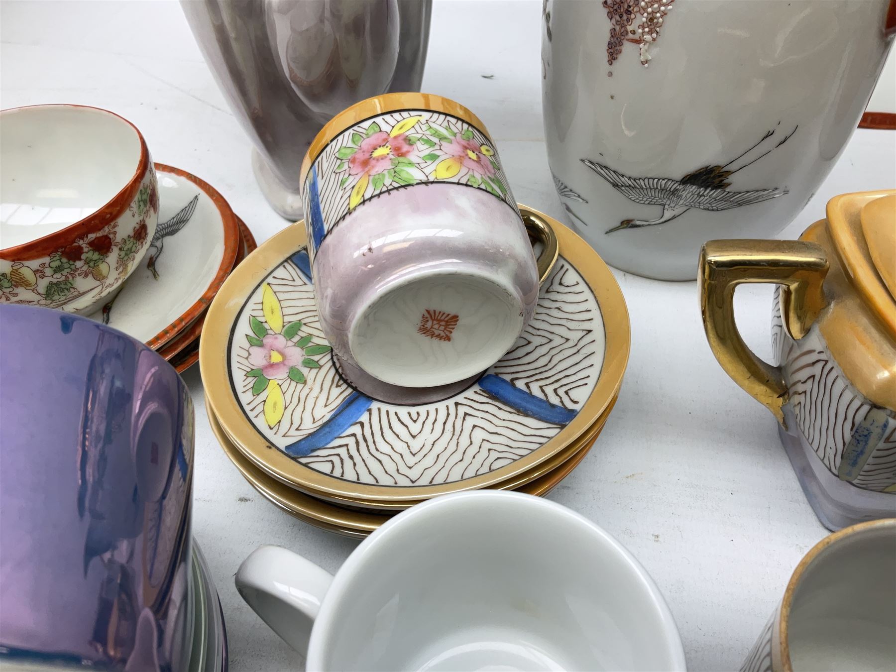  Japanese eggshell tea service, decorated with cranes and wisteria, to include teapot, coffee pot, coffee cans plates etc, together with another coffee set and John Lewis coffee cans  