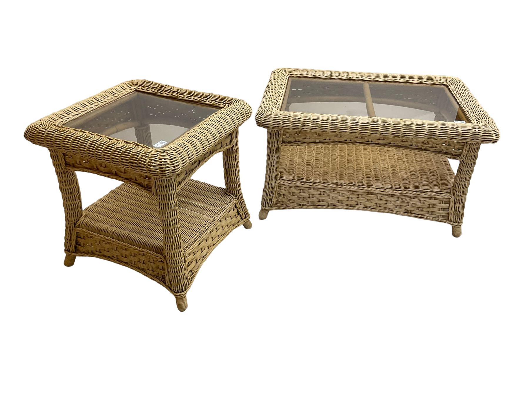 Contemporary rattan conservatory suite - two seat sofa with wicker frame and loose cushions upholstered in textured champagne fabric (W125cm H98cm); pair of matching armchairs (W72cm H98cm); rectangular glass-topped coffee table with rattan frame and undertier (W85cm D60cm H47cm); and matching square side table (W53cm H55cm)
