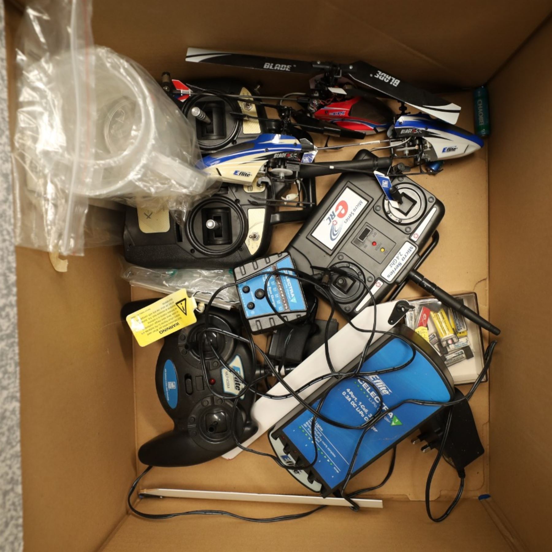 A collection of Remote control airplanes and helicopters; comprising four airplane built models, Walkera WK-2801 Pro transmitter boxed in a flight case, miscellaneous small RC helicopter parts and transmitters 