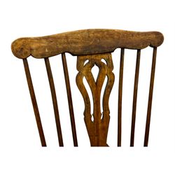 19th century provincial elm and beech Windsor armchair, shaped cresting rail over stick back with pierced and shaped splat, the dished seat on turned supports united by turned stretchers 