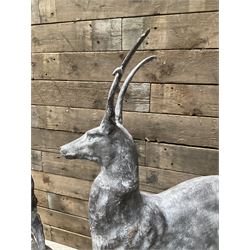 Pair of cast iron garden Stag figures or gate finials, raised on spherical ribbed base 