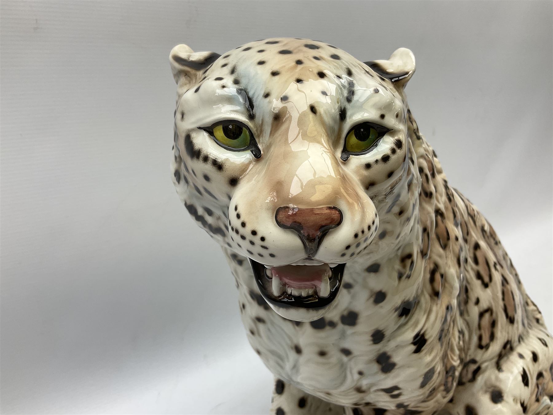 Ronzan fireside model of a snow leopard, with printed mark beneath, H38cm 