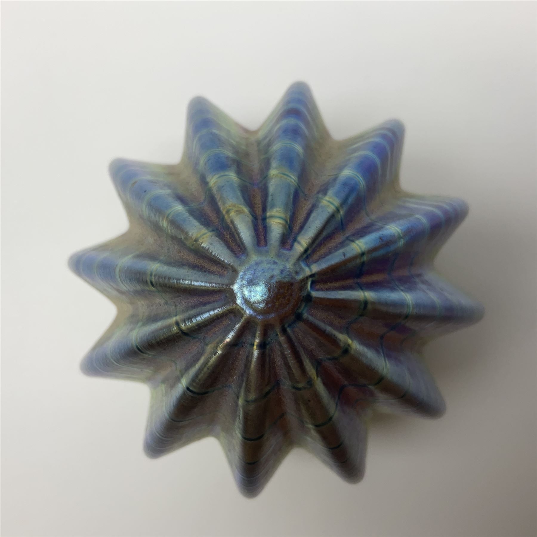 Robert Held iridescent art glass sea urchin paperweight, signed to underside, together with Murano glass clown and a collection of other glass paperweights and animals, etc 