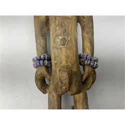 Early 20th century West African Yoruba family wooden figure of Orisha Oko, the god of farming/agriculture, carved from the solid, bears manuscript label of provenance verso H26.5cm