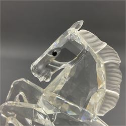 Five Swarovski Crystal horses, comprising stallion, rearing horse, pair of horses playing and Arabian stallion, each with frosted manes and tails, together with a small Swarovski Crystal galloping horse, the mane, tail and base with smoky tint