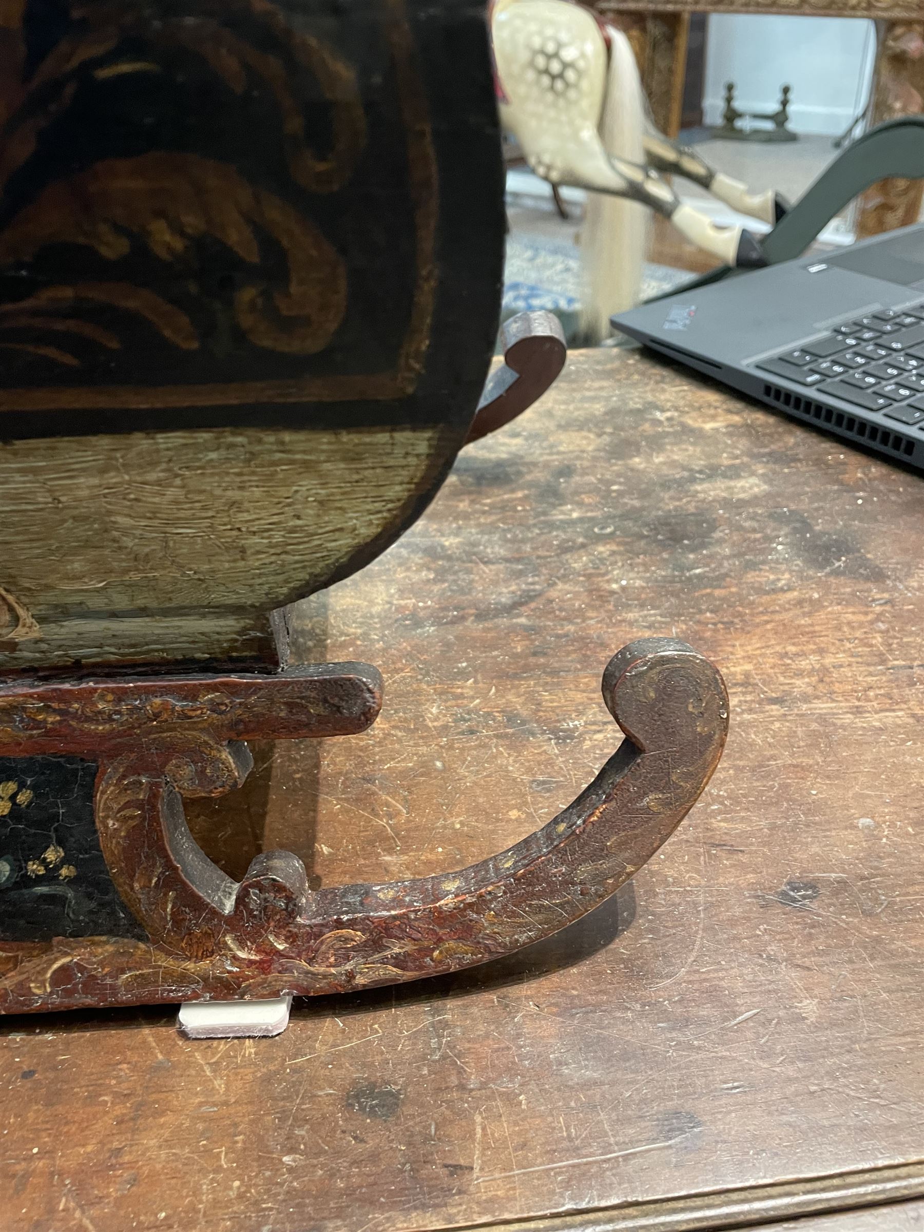 Unusual 18th century small Northern European wooden sled, with curved scroll back, the sides painted with coastal shipping scenes, the interior with removable zinc liner, upon curved irons painted with flower heads, H36cm W56cm D29cm