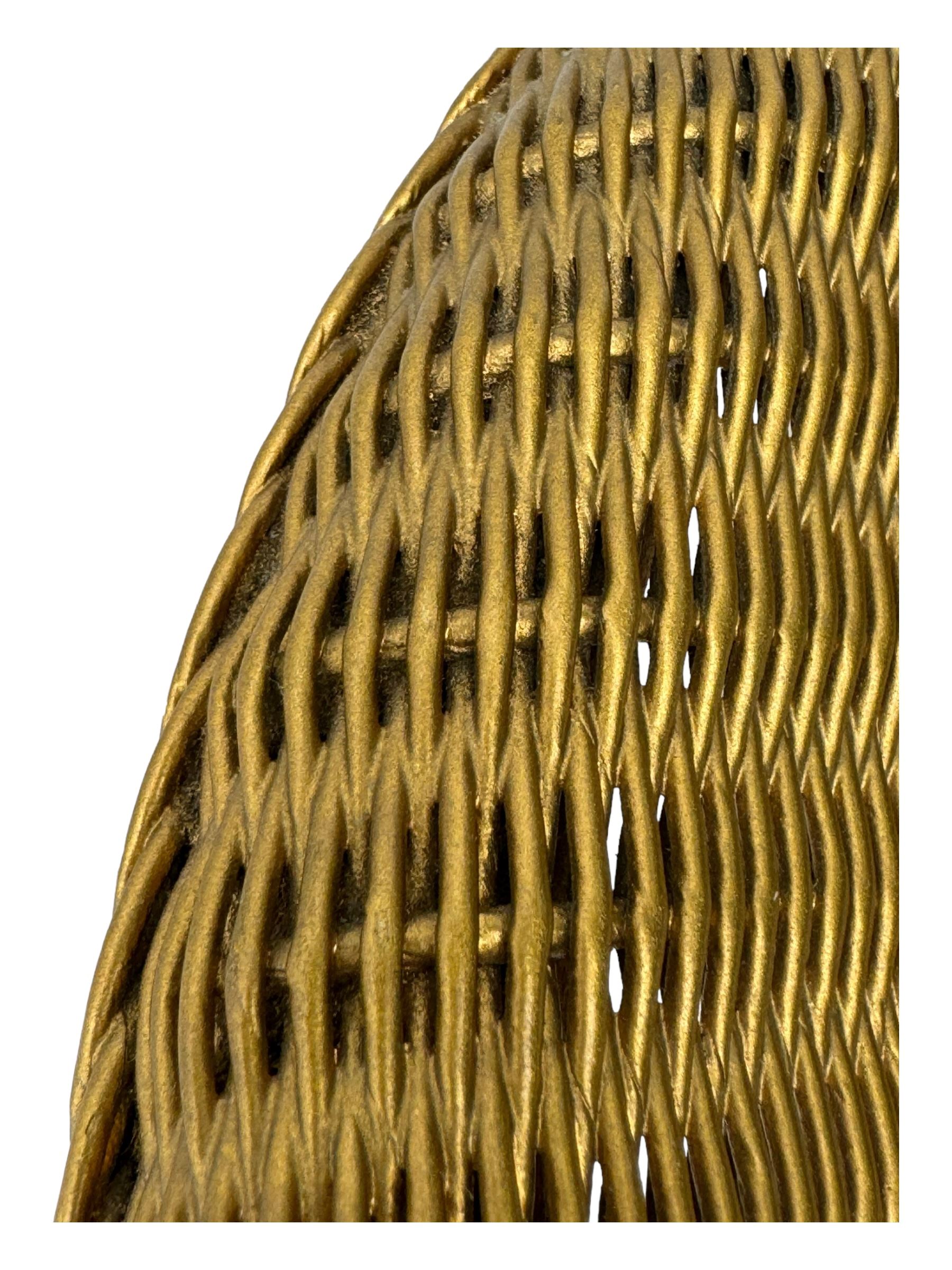 Early 20th century Lloyd Loom wicker armchair, bronzed wicker frame with woven seat and backrest, curved armrests, on round supports