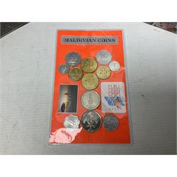 Coins and banknotes including Euros, Greta British pre decimal coinage, Kenyan banknotes, United States of America one dollar note etc, housed in various folders and loose, in one box