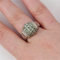 14ct white gold alexandrite and diamond stepped design ring, three rows of round cut alexandrite's, with a row of single cut diamonds either side, the shoulders with engraved foliate decoration, hallmarked