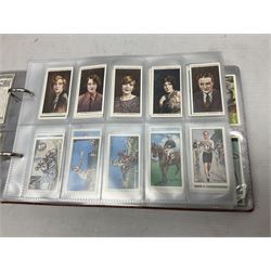 Four modern loose leaf albums containing a large quantity of cigarette cards by Players, Wills, Lambert & Butler and Gallahers including Recruiting Posters, Military Motors, shipping, aviation, military and medals, cricketers and other sporting, horsemanship, royalty etc; three in slip cases (4)