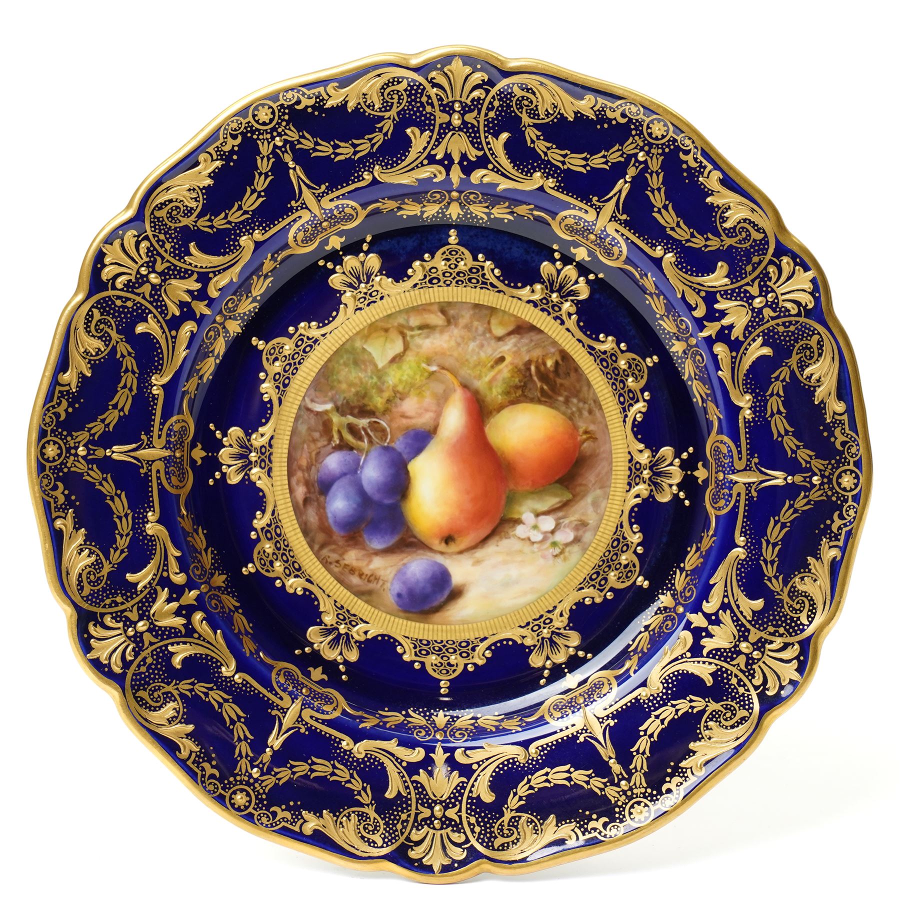 Royal Worcester Cabinet Plate, painted by Richard Sebright, the central panel decorated with fruit, within an elaborate gilt border on a cobalt ground, marked to base, D22cm 