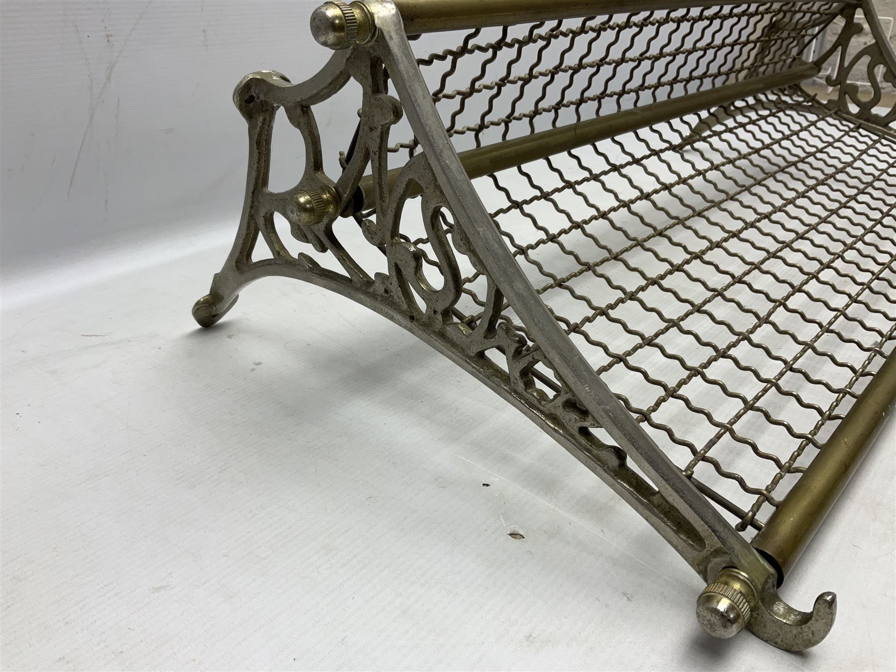 Railway interest - carriage compartment style wall mounting brass and mesh luggage rack, the ends cast with the initials NSWR (New South Wales Railroad) L77cm