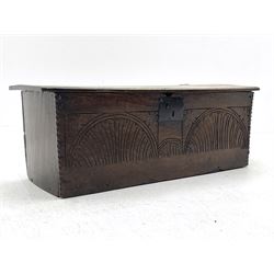 18th century boarded oak coffer, hinged lid with front mould and chip-carved decoration, the front carved with foliate lunettes and spandrels, iron lock