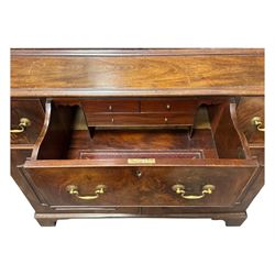 George III mahogany bookcase secretaire, dentil cornice over blind fret work frieze, enclosed by two astragal glazed doors, central secretaire drawer with fall front enclosing leather writing surface and small drawers, two flanking short drawers over double cupboard, on bracket feet