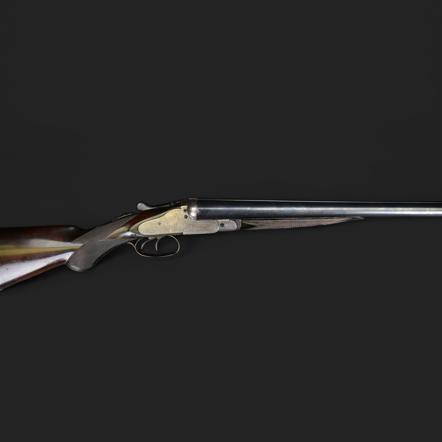 Carr Brothers of Huddersfield 12 bore side by side shotgun with engraved sidelock plates, trigger guard, underside, top plate, thumb lever and fences, chequered semi-pistol grip and horn tipped forend, vacant cartouche to the underside of the stock, double trigger and named 28 inch sleeved barrels choked ¾ and ½, overall length 113cm SHOTGUN CERTIFICATE REQUIRED