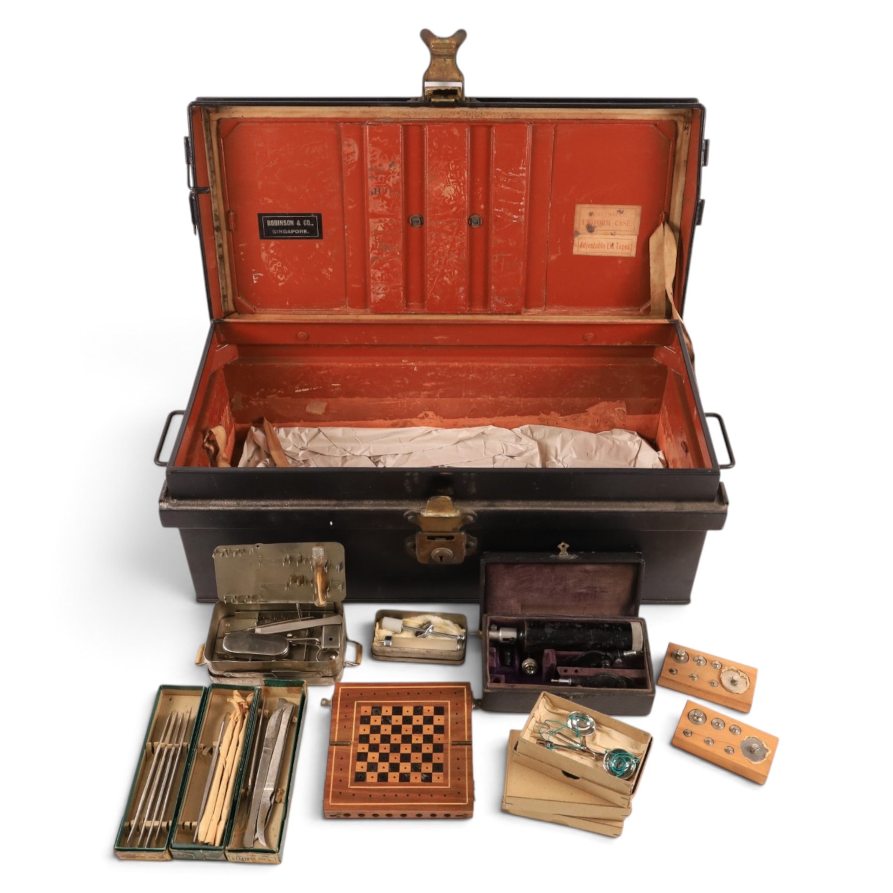 Field medical equipment, including scalpels, syringe, small weights and scales, ophthalmoscope, etc, contained within a steel uniform case