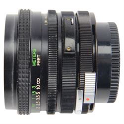 Two Canon SLR camera bodies, comprising Canon A-1 serial no. 718442 and Canon T90 serial no. 1195139, together with a Canon FD 50mm 1:1.8 lens, Canon FD 100-300mm 1:5.6 zoom lens, Vivitar 200mm 1:3.5 Auto Telephoto lens no. 28403440, Vivitar 24mm 1:2.8 Auto Wide Angle Lens and Sigma Telephoto 1:5.6 f=400mm lens and other accessories contained within two soft carry cases