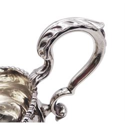 Pair of George III silver sauce boats, each of typical form with gadrooned rim, and acanthus capped scroll handle, upon three shell mounted shell pad feet, hallmarked George Methuen, London 1760 including handle H13cm, approximate total weight 30.25 ozt (941 grams)