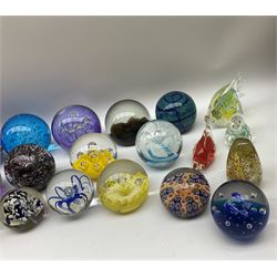 Collection of glass paperweights, to include an example marked Selkirk Glass Scotland beneath, six modelled as fish, and others of spherical or pear form with various internal decoration including controlled bubbles, canes, flowers, etc. 