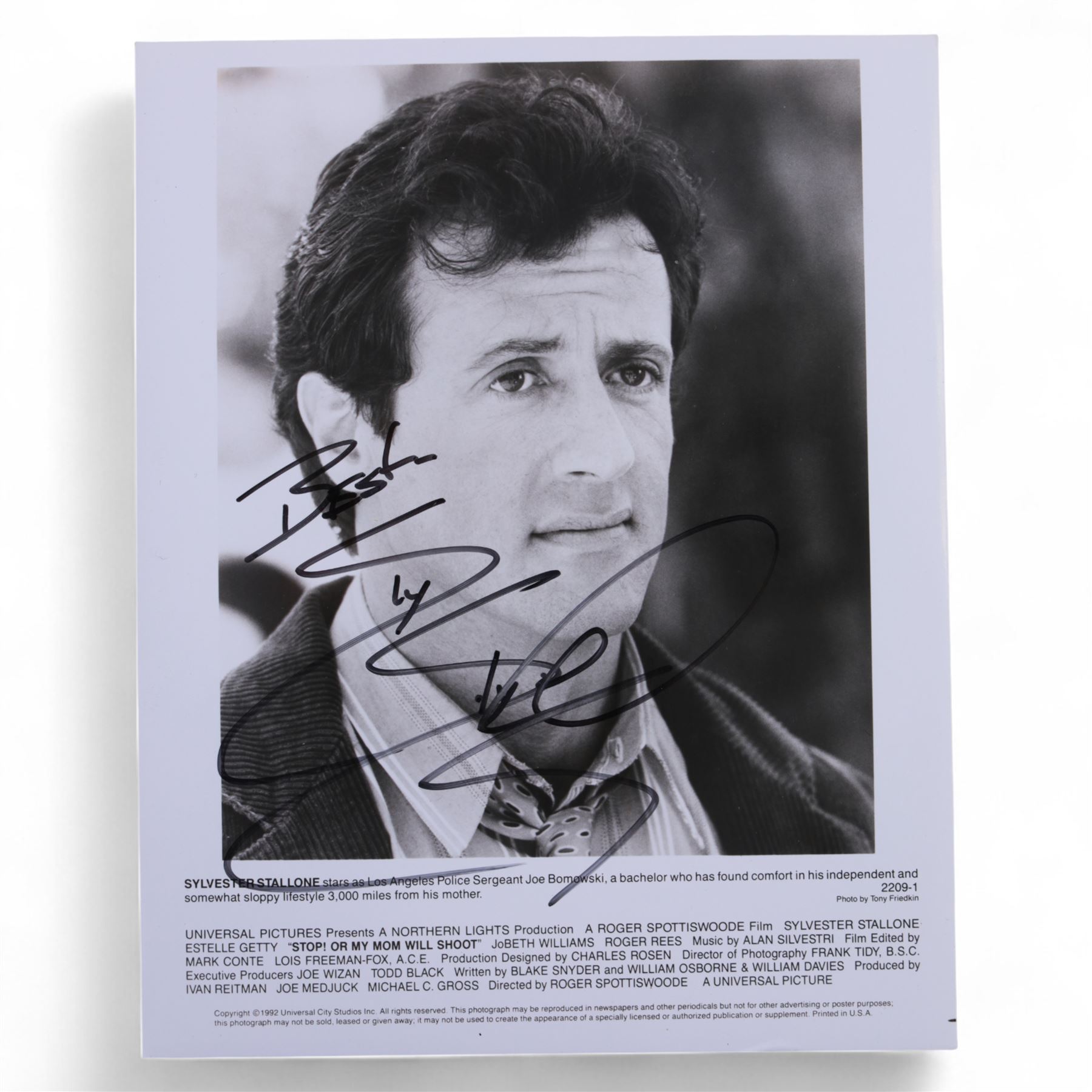 Four Sylvester Stallone film stills and promotional shots, including one depicting Rocky Balboa in the ring, three signed by Sylvester Stallone and one signed by Brigette Nielsen, all with certificates of authenticity