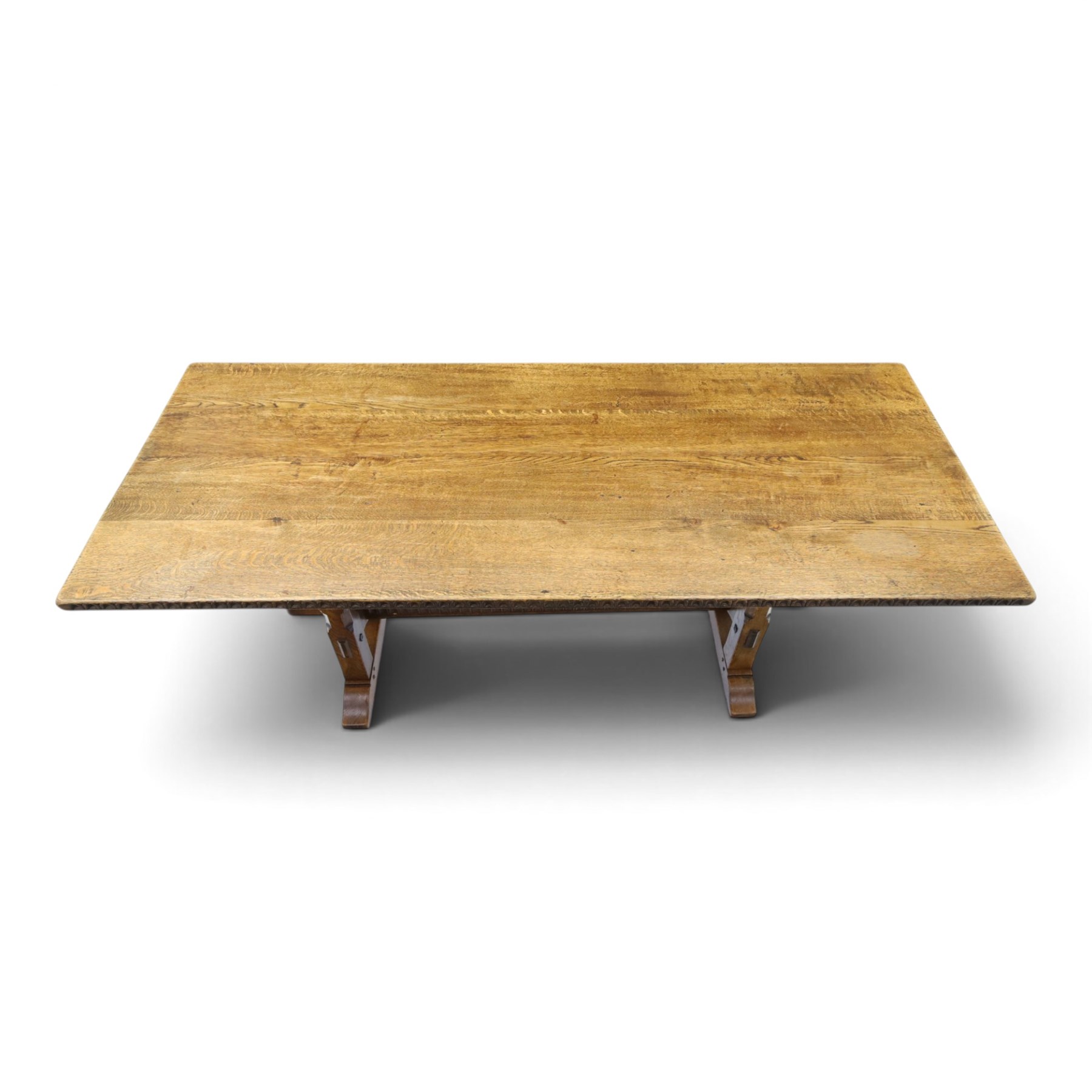 Rupert Griffiths for Monastic Woodcraft - oak 6ft refectory dining table with set six (4+2) matching chairs, rectangular top with arcaded frieze, with trestle base with further arcaded carved stretchers, chairs with carved rails and finials, leather wrapped seats with stud detail, turned supports united by carved stretcher