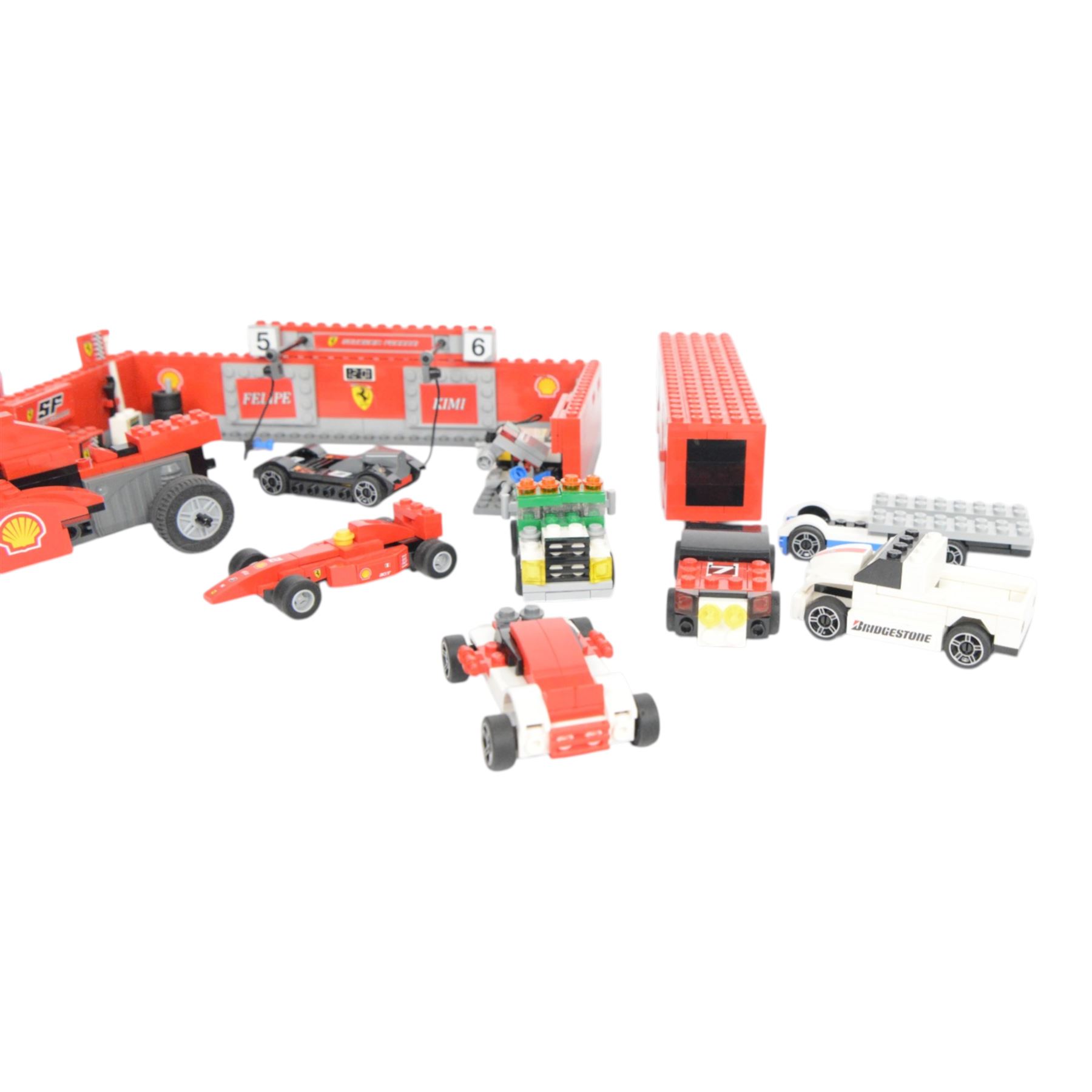 Lego Racers set Ferrari F1 Pit no. 8155, further racing related Lego pieces, all partially built, unboxed with instructions
