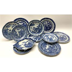 A group of 19th century blue and white transfer printed pottery, various makers and patterns, to include Minton Queen of Sheba pattern plate, Joshua Heath Reindeer pattern plate with towering pagoda, and seal in the foreground, a number of plates decorated in the Chinoiserie Bridgeless pattern, two Mandarin type pattern plates, possibly Spode, etc. 