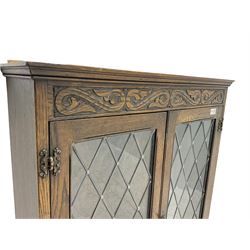 Oak bookcase with lead glazed doors