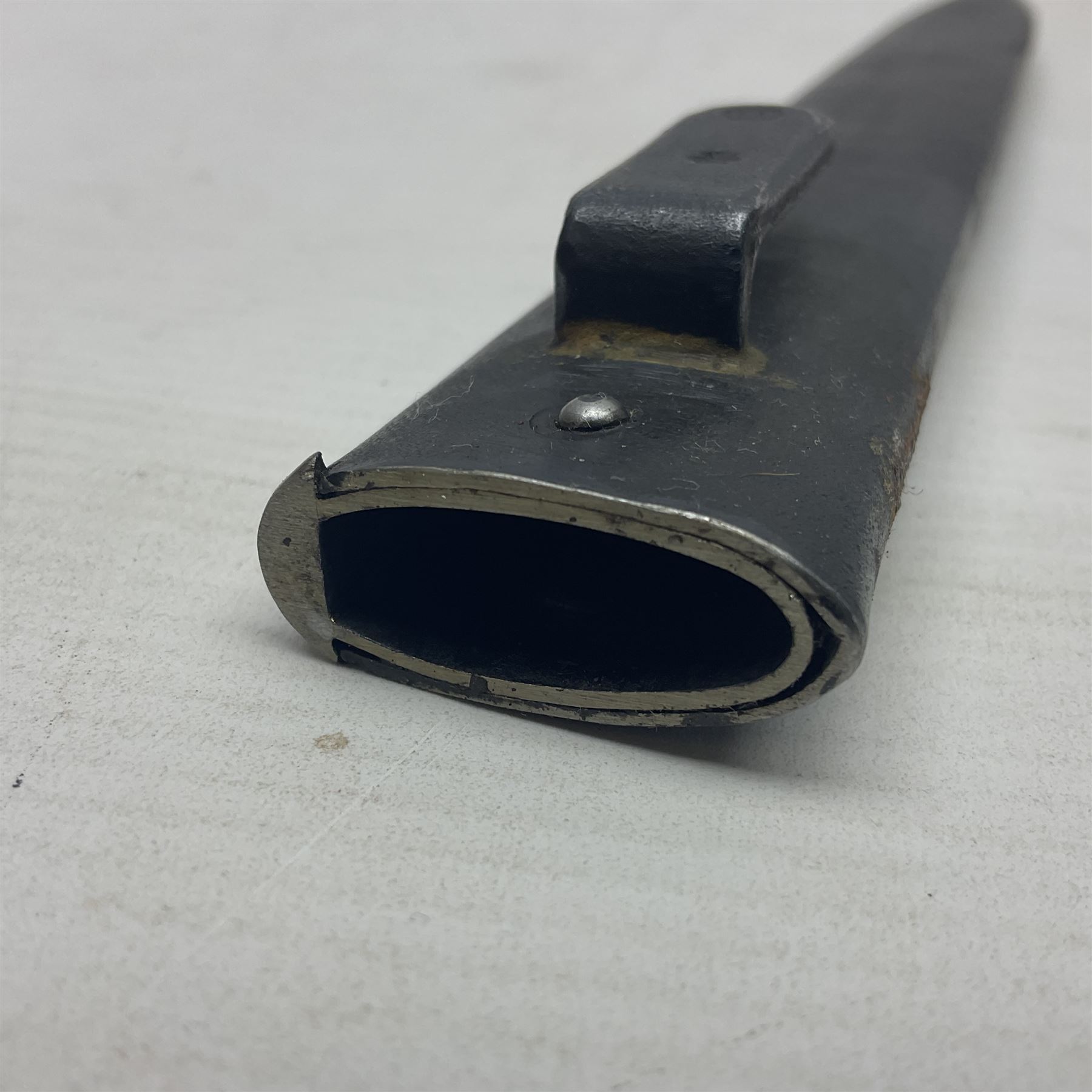 Austrian Model 1895 Carbine knife bayonet with 24.5cm fullered steel blade; various marks to the ricasso including F.G. GY.; cross-piece marked No.7843; in steel scabbard L37cm overall