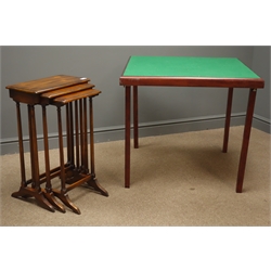  Early to mid 20th century nest of three walnut tables, turned and fluted columm supports on arched sledge feet, (W43cm, H67cm, D23cm), and a games table with green baize on folding supports  