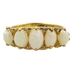 18ct gold graduating five stone opal ring, with diamond accents set between, hallmarked
