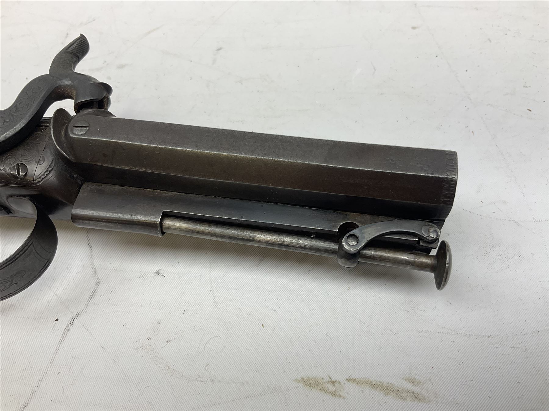 Early 19c percussion double barrel Howdah pistol by J. Blisset London, c1840s, approximately 50 calibre, 10.5cm octagonal monobloc barrels with captive swivel ramrod under, finely chequered walnut stock, engraved hammers, lock plates, tang and trigger guard, butt plate with hinged cap compartment, vacant white metal oval escutcheon L25.5cm overall