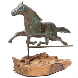 Copper weathervane formed as a leaping horse, mounted upon naturalistic base, W77cm
